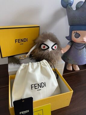 Fendi Brown Fur Monster Bag Charm with White Face and Red Eyes